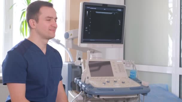 Portrait Young Ultrasound Doctor His Office Sitting Machine Diagnosis Diseases — Vídeo de Stock