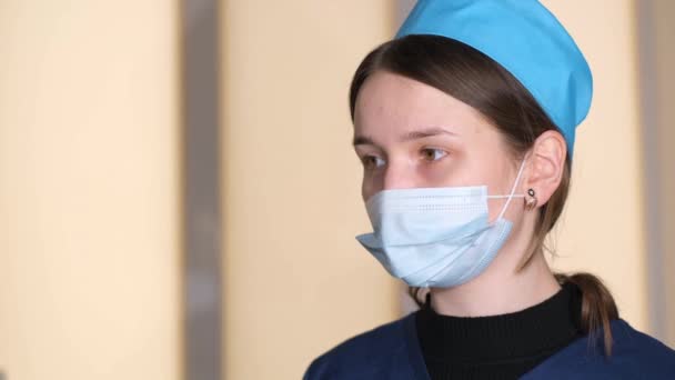 Portrait Young Tired Nurse Looking Camera Nurse Work Mask Uniform — стоковое видео