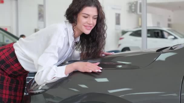 Beautiful Girl Strokes Electric Car Buying New Car Dealership — Stock videók