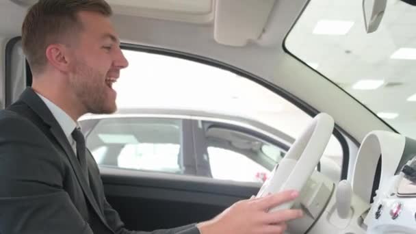 Happy Smiling Man Sitting Interior New Car Car Dealership — Stok Video