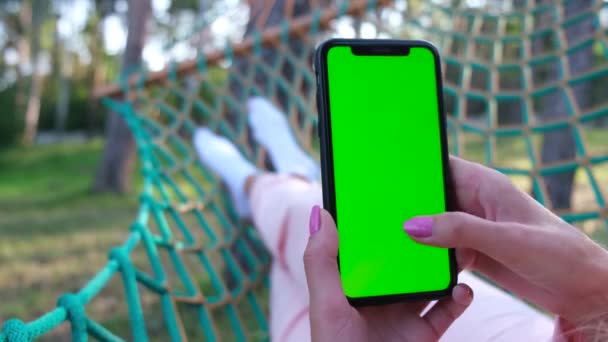 Smartphone Green Screen Hands Woman Swinging Hammock Garden Outdoor Recreation — ストック動画