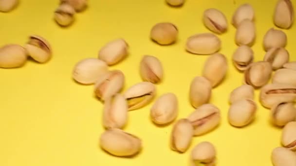 Pistachio Nuts Yellow Background Close Slow Motion — Vídeo de Stock