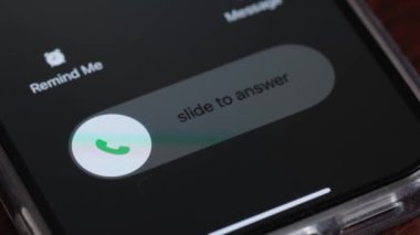 Macro video of an incoming call on a mobile phone. Pick up or reject a call on your smartphone.
