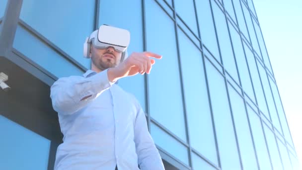 Stylish Businessman Using Virtual Reality Glasses Standing Front Business Center — Αρχείο Βίντεο