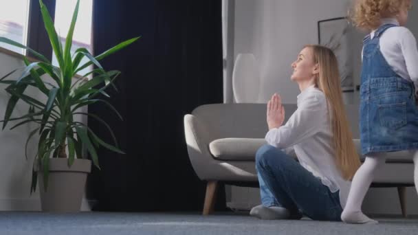 Beautiful Young Mother Doing Yoga Her Little Daughter Running Room — Wideo stockowe
