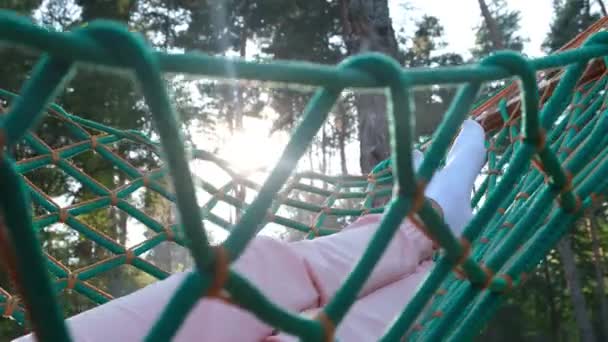 Little Girls Legs Swinging Hammock Green Garden Outdoor Recreation — Stockvideo