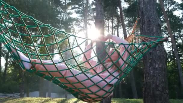 Young Woman Meeting Morning Sunrise Sits Hammock Lazily Stretches Her — Stockvideo