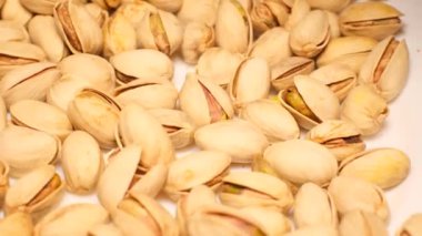 Full frame closeup shot showing lots of roasted pistachio fruits. Tasty pistachios. Healtii organic food. 