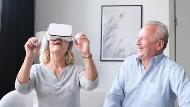 Elderly Man Happily Looks His Wife Wearing Glasses New Technologies — Stockvideo