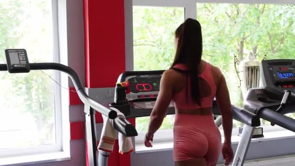 Woman Red Sportswear Walks Treadmill Gym Healthy Lifestyle — Stockvideo