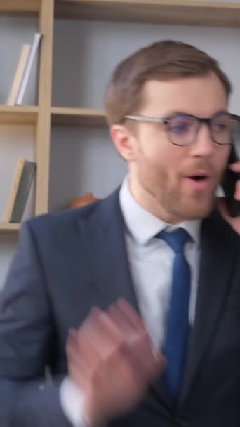 Angry Young Business Man Talking Mobile Phone While Standing Middle — Stockvideo