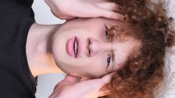 Close Face Worried Red Haired Curly Guy Looking Camera Headache — Stockvideo