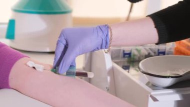 The procedure for taking blood from a patient. A nurse draws blood from a vein using a sterile needle and tube. Laboratory examination of blood