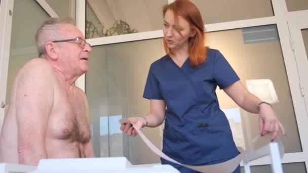 Professional Doctor Makes Cardiogram Heart Elderly Man Medical Examination Clinic — Stock Video