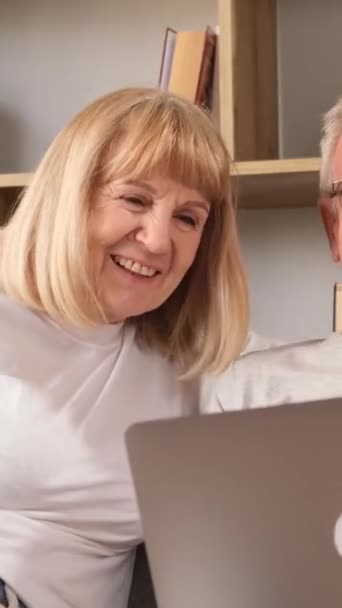 Happy Grandparents Sitting Sofa Hugging Looking Laptop Screen Pensioners European — Stock Video