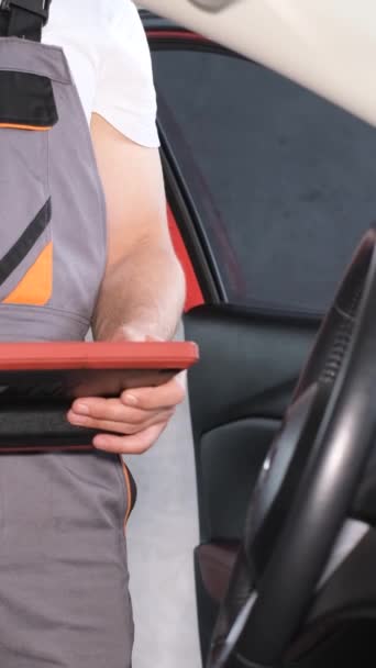 Mechanic Examines Cars Board Computer Using Digital Tablet Computer Car — Stock Video
