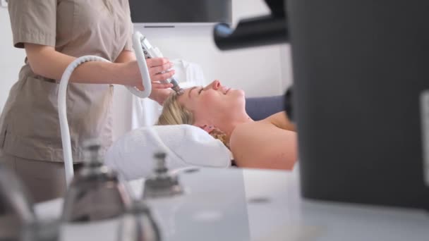 Cosmetologist Performs Vacuum Facial Massage Facial Care Rejuvenation Girl Takes — Stock Video