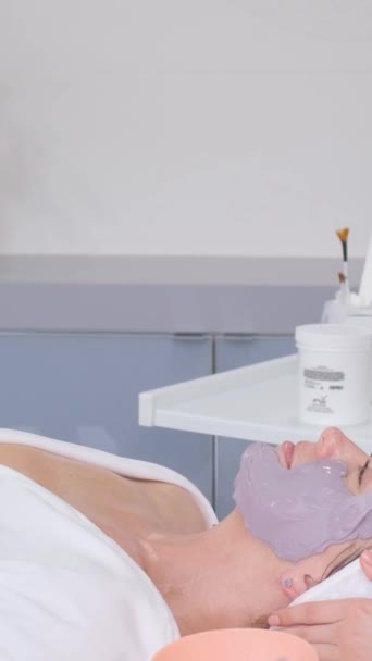 Skin Care Procedure Beautician Applies Moisturizing Mask Clients Face Vertical — Stock Video