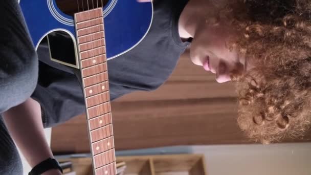 Young Curly Haired Musician Guitar Plays Calm Sad Melody Young — Stock Video