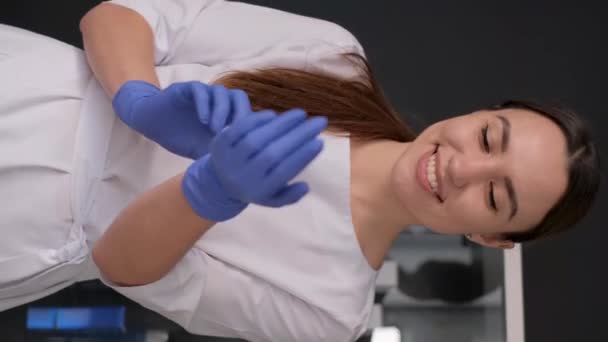 Beautiful Female Doctor Wears Blue Rubber Gloves Healthcare Concept Vertical — Stock Video