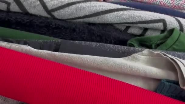 Close Woman Inspecting Second Hand Clothes Buying Used Clothes Vertical — Stock Video