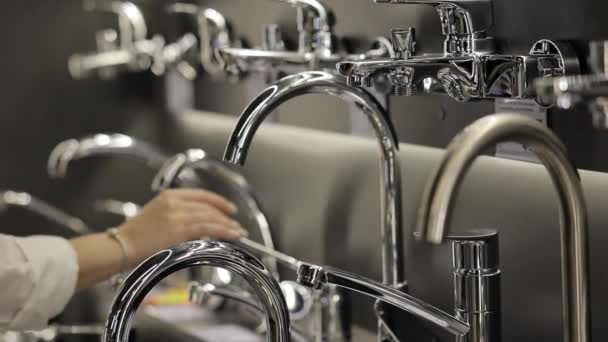 Woman Examines Water Faucets Store Visual Concept Bathroom Renovation Repair — Stock Video