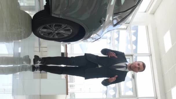 Young Man Poses New Cars Car Showroom Standing New Cars — Stock Video