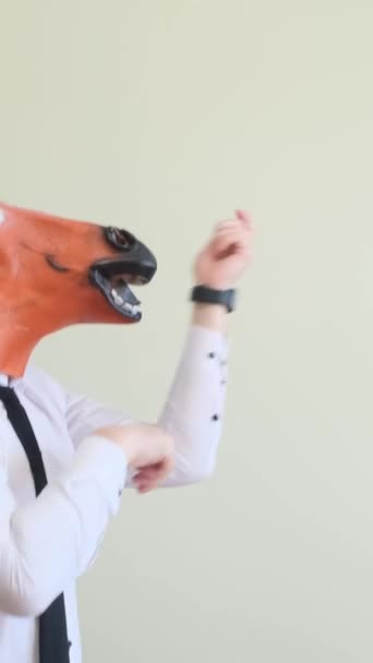 Crazy Young Man Horse Mask Dancing Rhythmically White Background Slow — Stock Video