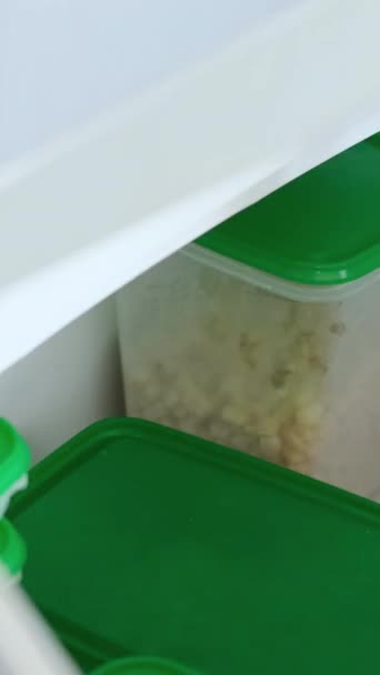 Woman Carefully Puts Ready Food Container Storage Puts Refrigerator Keeping — Stock Video