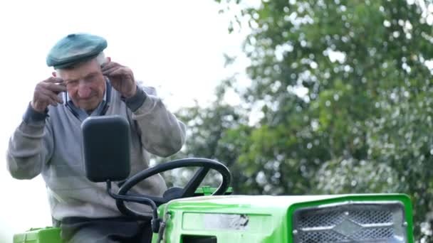 Old Grandfather Engaged Gardening Garden Uses Mini Tractor Cultivate Garden — Stock Video