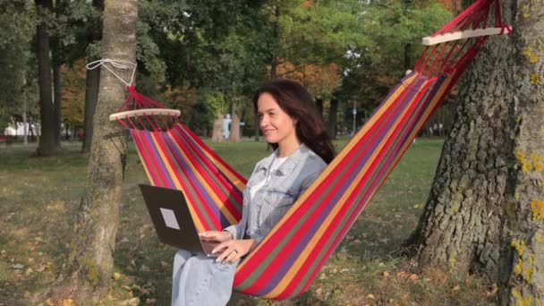 Beautiful Woman Laptop Garden Sitting Hammock Green Background Remote Work — Stock Video