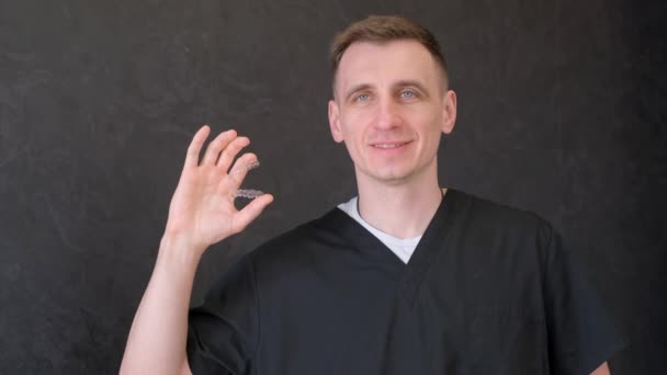 Orthodontist Wearing Gloves Holding Silicone Invisible Transparent Braces Dental Clinic — Stock Video