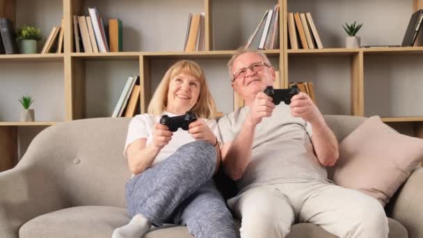 Senior Couple Playing Games Using Consoles Life Retirement — Stock Video