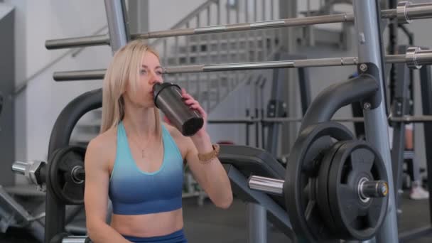 Healthy American Woman Sportswear Drinks Bottle Protein Shake Working Out — Stock Video