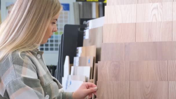 Female Customer Chooses Linoleum Interior Store Apartment Renovation Concept — Stock Video