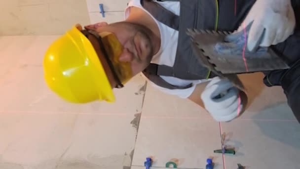 Man Donning Hard Hat Safety Glasses Sporting Beard Engaged Wall — Stock Video