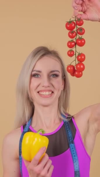 Blond Woman Happily Holds Yellow Pepper One Hand While Clutching — Stock Video