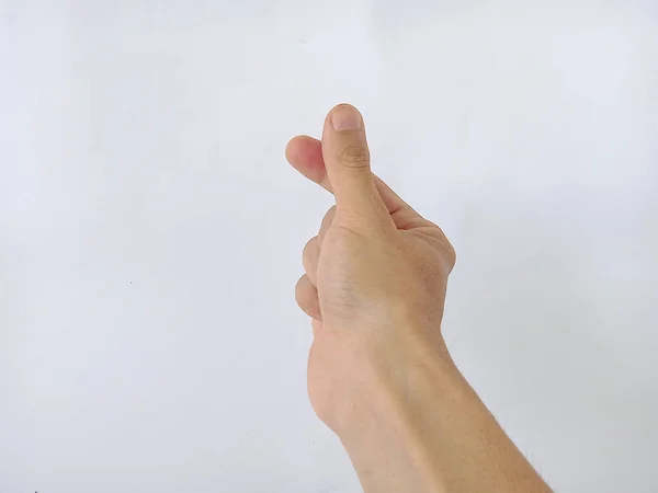 Photo of hands forming a love symbol using the thumb and index finger on a white background, Korean symbol