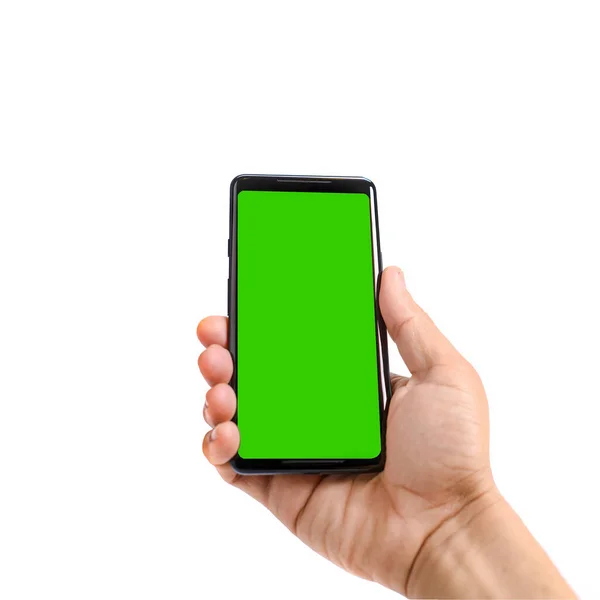 stock image Male hand holds black smartphone. Isolated screen with chroma key and all isolated on white background