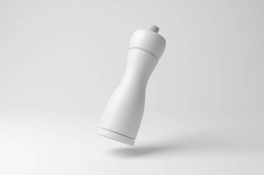 Beyaz arka planda, tek renk ve minimalizmde havada süzülen beyaz baharat değirmeni. Baharat, baharat ve yemek pişirme kavramının yansıması.