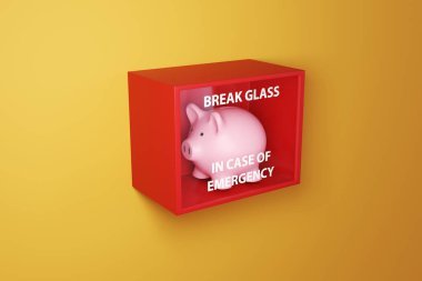 Sarı bir duvarda, kırmızı bir kutuda pembe domuz kumbarası ve üzerinde talimat kırma camı olan cam baskı var. Acil durum fonu ve finansal tampon kavramı