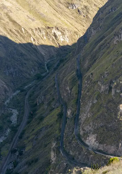 stock image Railway crossing the mountain on several levels. The mountain is in the shade at also in the sun. Nariz Del Diablo, Ecuador