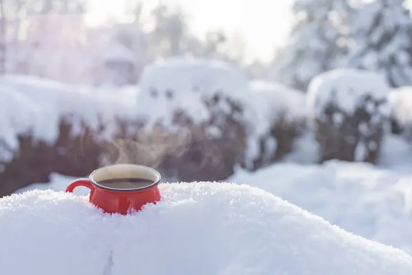Coffee in a cup on the background of a winter theme