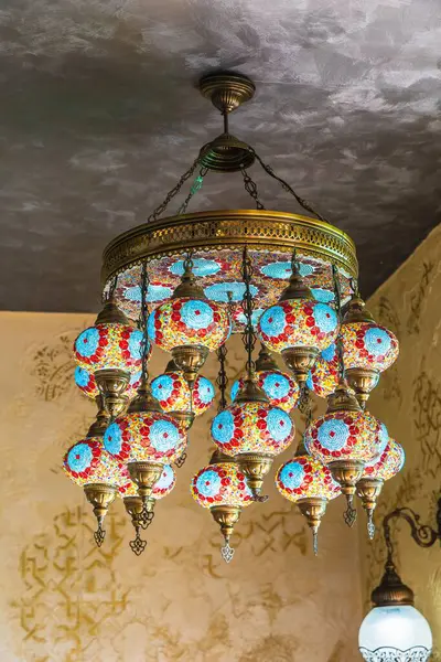Colorful lamp with decorative patterned glass decoration in oriental style related to Arabic or Turkish culture.