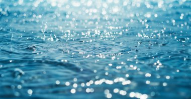 Close-up photo of water splash. Splash of rain or sea water. clipart