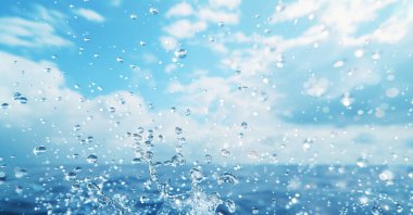 Close-up photo of water splash. Splash of rain or sea water. clipart