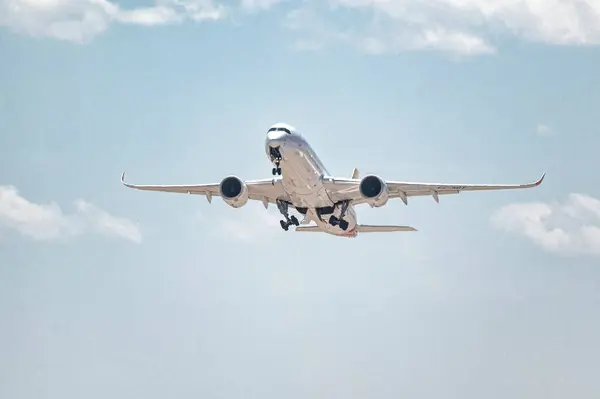 stock image Madrid, Spain; 05-24-2024:Airbus A350 model aircraft of the Spanish company Iberia during the takeoff maneuver, storing the landing gear while gaining altitude