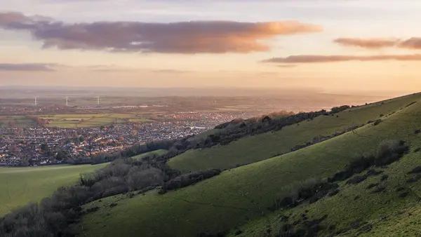 Winter sunrise over the east Sussex countryside from Combe Hilll Butts Brow Eastbourne east Sussex south east England