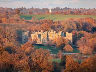 Bodiam castle during autumn from the high weald east Sussex south east England UK clipart