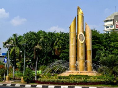 Surabaya - Indonesia, October 13, 2024.Surabaya's Bambu Runcing Monument commemorates the heroes' service in fighting the Dutch colonizers in defense of independence. Eye view level. clipart